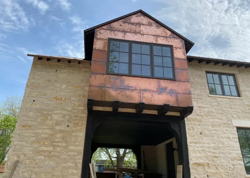 Copper metal panel facade on a stone building for Skylight Installation in Pasadena