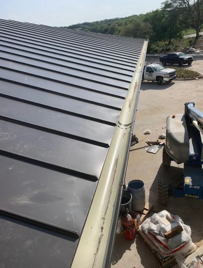 Standing seam panel and gutter detail on a metal roofing jobsite in Pasadena